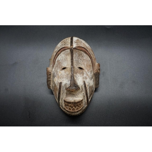 1443 - Ethnographica: an Igbo tribal mask, Democratic Republic of Congo, with white pigment, 19cm.... 