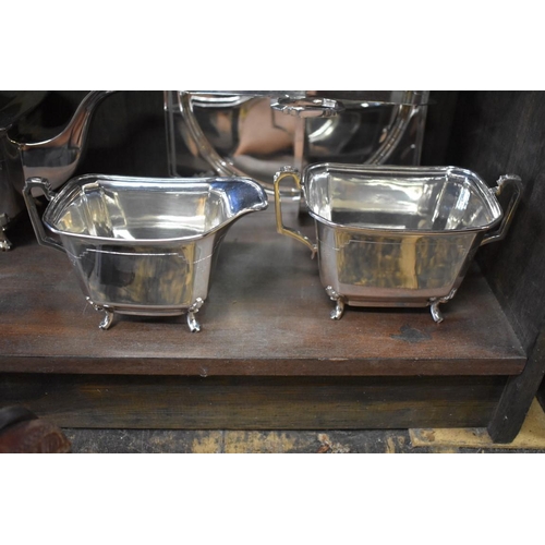 1520 - An Art Deco electroplated four piece teaset; together with a similar sandwich plate.... 