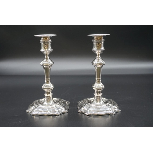 1597 - A pair of electroplated candlesticks, 19.5cm high. 
