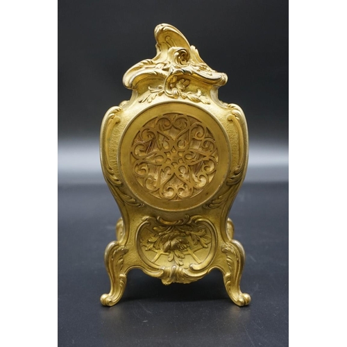 1629 - A Louis XV style cast brass cased mantel timepiece, in the Rococo style, 20cm high. ... 