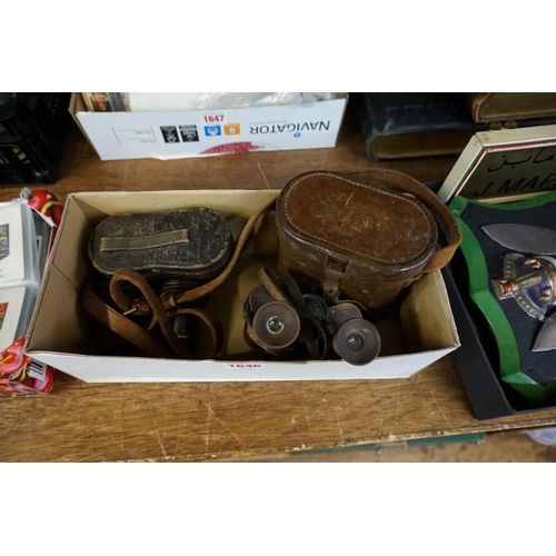 1646 - A pair of World War I period binoculars, in leather case; together with another cased pair of opera ... 