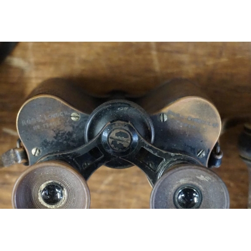 1646 - A pair of World War I period binoculars, in leather case; together with another cased pair of opera ... 