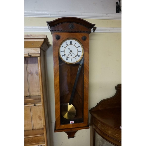 1807 - A late 19th/early 20th century walnut Vienna style wall clock, with enamel dial and weight driv... 