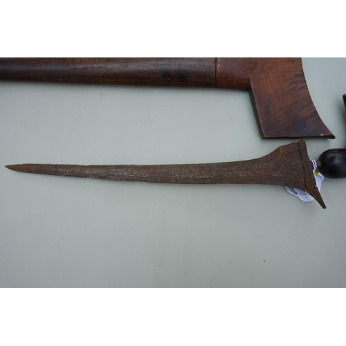 1916 - An Indonesian kris and wood sheath, probably Sumatran, with 33cm straight blade and patinated wood h... 