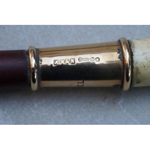1918 - A good 9ct gold mounted ivory handled and holly coaching whip, the gold mount inscribed 'Lady M... 
