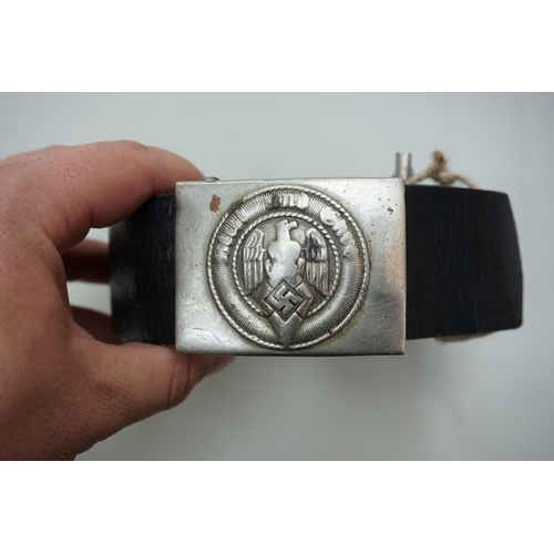 1934 - A German Third Reich Hitler Youth belt and buckle; together with a pair of brass and ebonized drumst... 