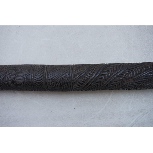 1944 - Ethnographica: an unusual Maori tribal carved wood staff or stick, carved all over with stylized dec... 