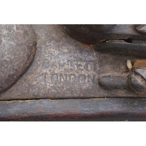 1932 - An antique long barrelled flintlock musket, the lock inscribed 'Barrett, London'.... 