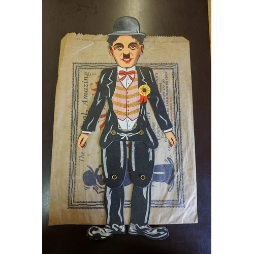 1943 - A scarce printed cardboard articulated 'Dancing Charlie (Chaplin) Illusion', in original paper bag a... 