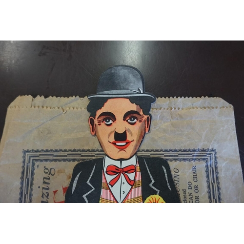 1943 - A scarce printed cardboard articulated 'Dancing Charlie (Chaplin) Illusion', in original paper bag a... 