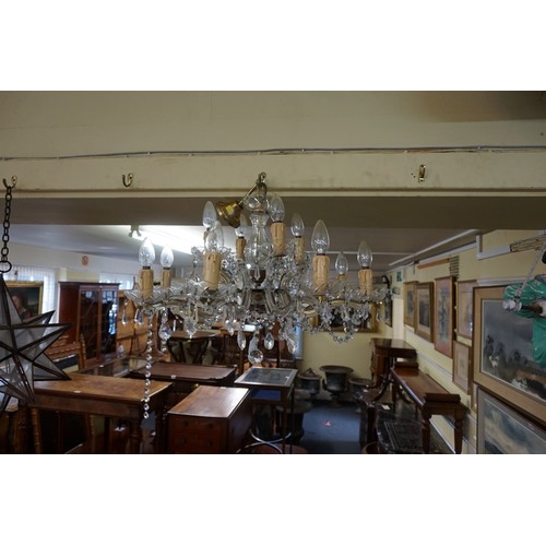 1927 - A faceted glass eight branch chandelier, approx 67cm diameter.