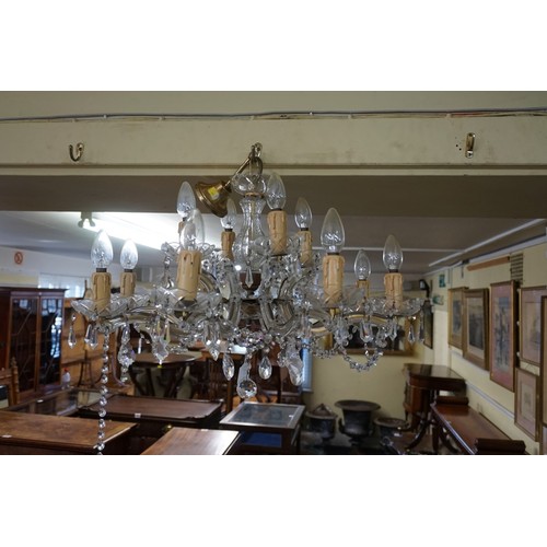 1927 - A faceted glass eight branch chandelier, approx 67cm diameter.