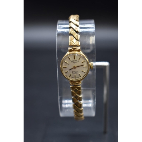 213 - A cased 9ct gold Rotary manual wind ladies wristwatch, 18mm, on replacement gold plated expanding br... 