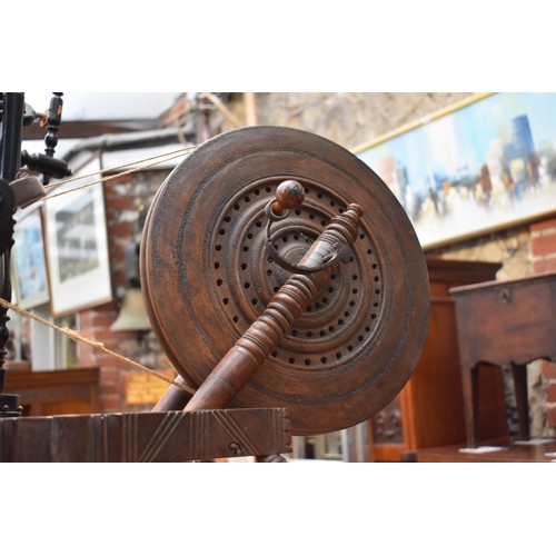 1250 - Two antique spinning wheels.