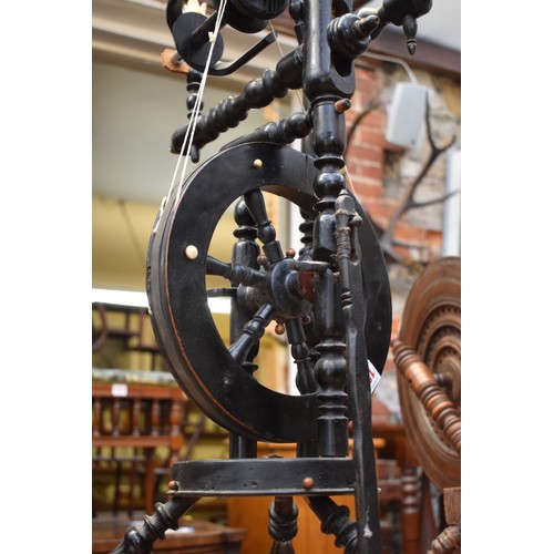1250 - Two antique spinning wheels.