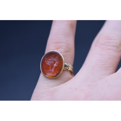 85 - An interesting antique yellow metal and carnelian intaglio ring, the intaglio possibly Roman, finely... 