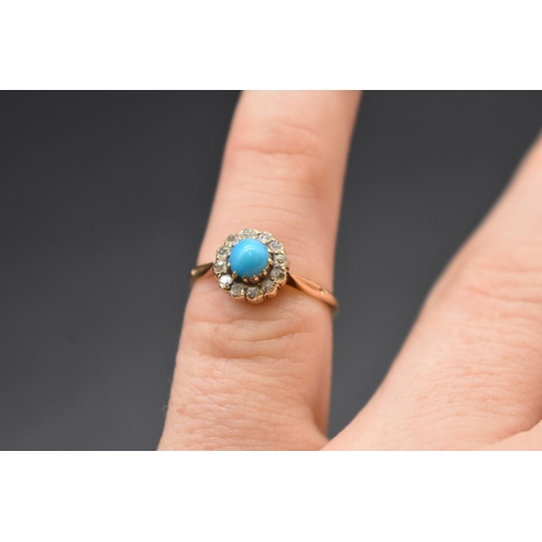 86 - A yellow metal ring, set central cabochon turquoise surrounded by mine cut diamonds, stamped 15ct, s... 