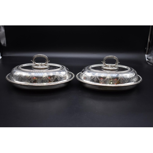 19 - A pair of Victorian silver entrée dishes and covers, by Frederick Elkington, Birmingham 1870, engrav... 