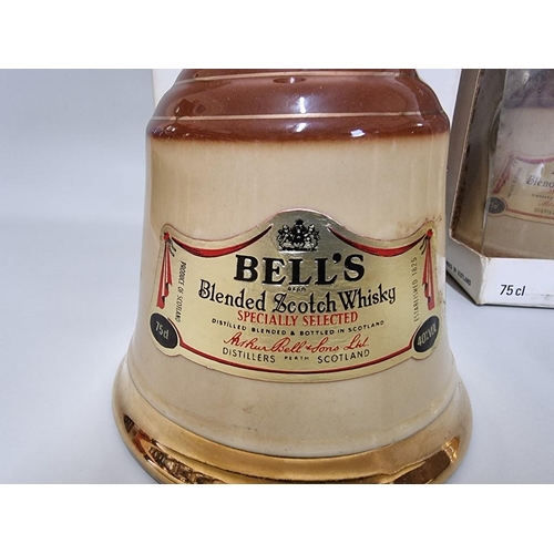 2 - Three old decanters of Bell's blended whisky, comprising: two 75cl examples and another 37.5cl examp... 