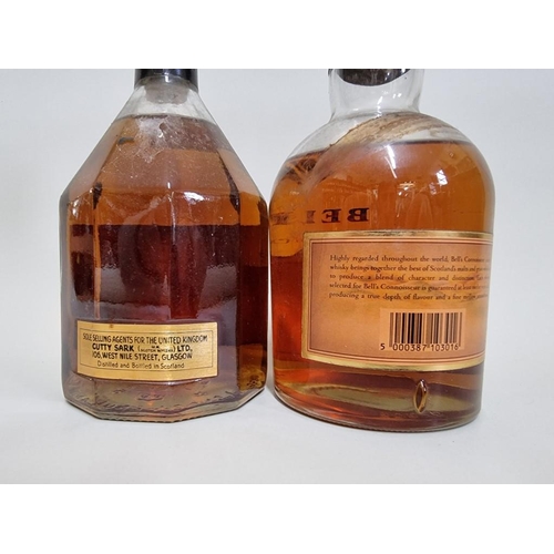 34 - Two old bottles of blended whisky, comprising: a 26 2/3 fl.oz. bottle of Cutty Sark 12 year old, 197... 