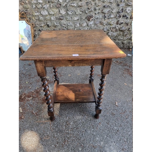 1019 - An oak occasional table, on barley twist legs, 70cm high x 57cm wide. 