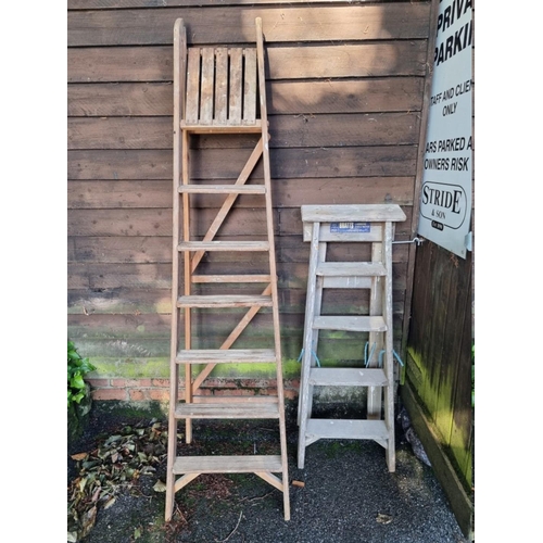 1022 - Two old wood folding step ladders. 