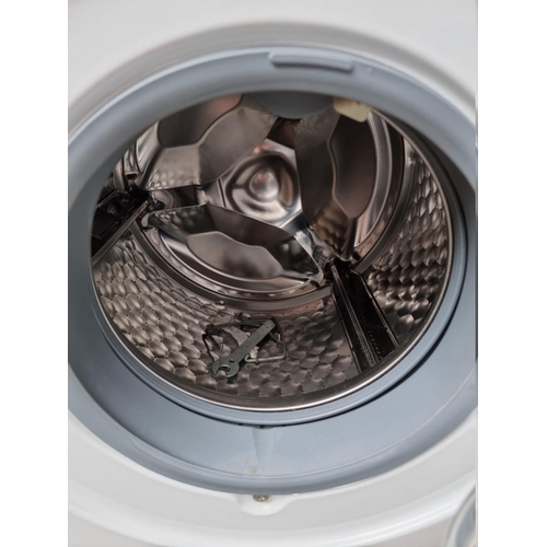 1036 - A Miele W1 classic washing machine, 84.5cm high x 60cm wide, with instruction manual.... 