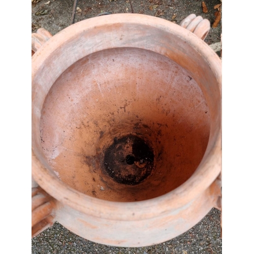 1038 - A terracotta urn, 53cm high x 40cm wide. 