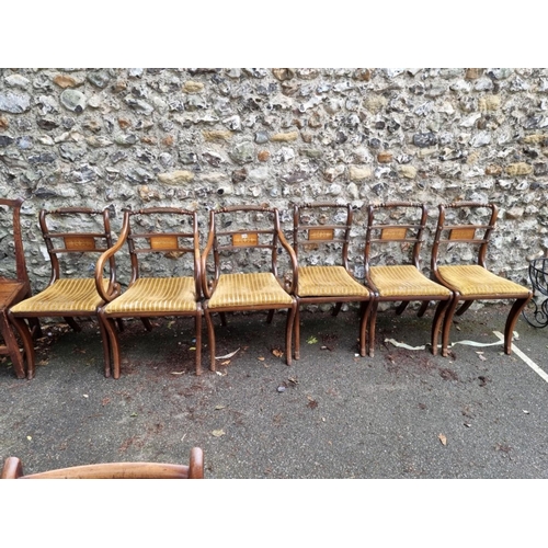 1039 - A set of six reproduction dining chairs, having brass inlay; to include a pair of carvers. ... 