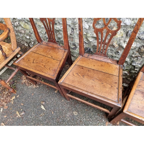 1041 - Three Georgian oak chairs; together with one other. (4)