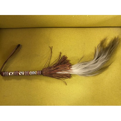 712 - Tribal horse hair fly swot with decorative bead handle...