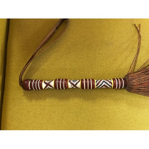 712 - Tribal horse hair fly swot with decorative bead handle...