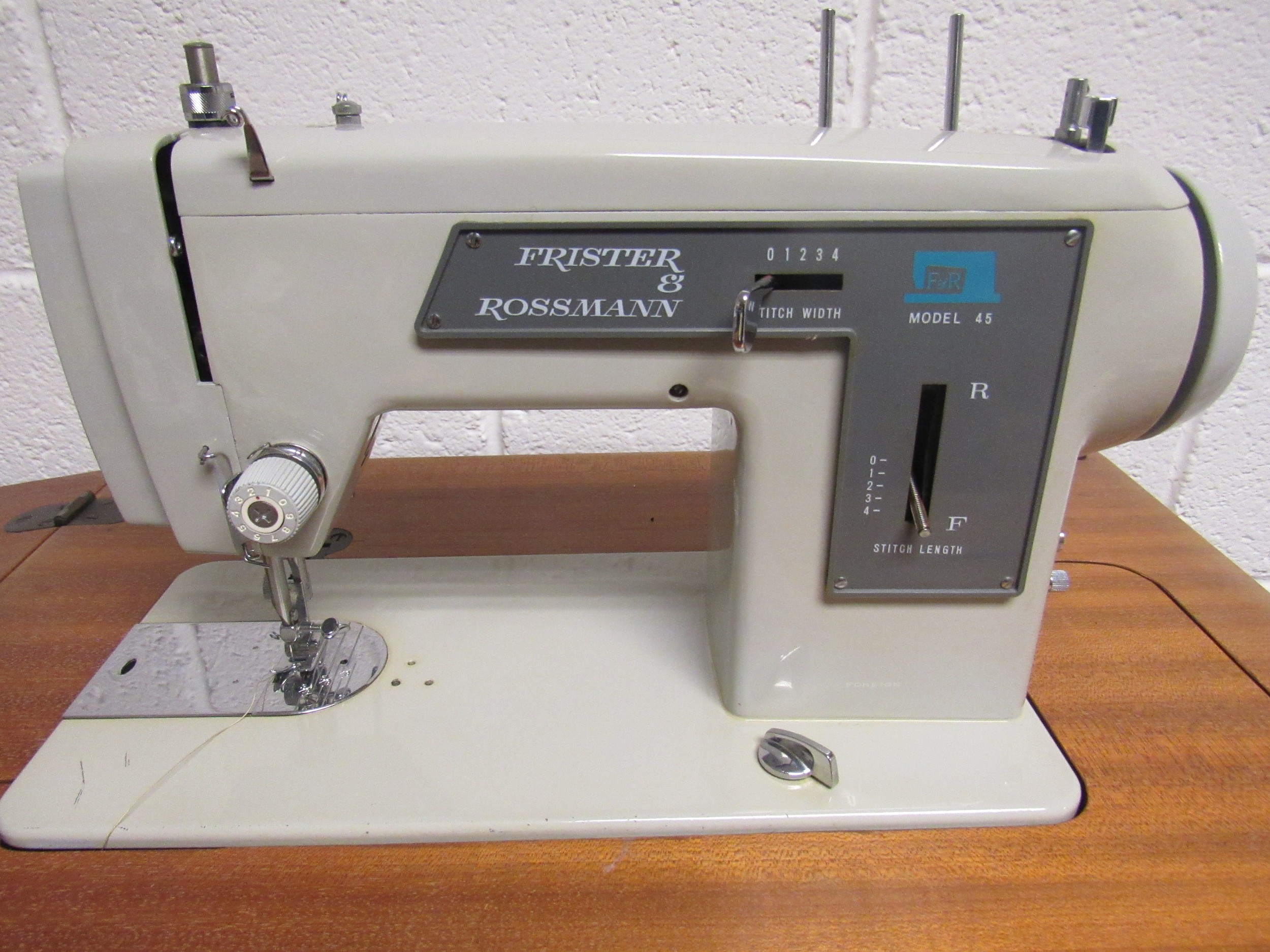 MidCentury Frister and Rossman model 45 sewing machine set within its