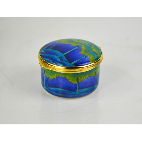 A Moorcroft hand painted enamel trinket box, in original presentation box.