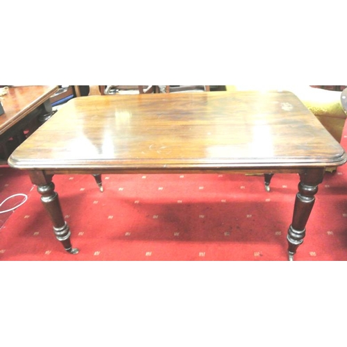 50 - Victorian mahogany oblong centre or dining table with rounded borders, raised on turned tapering leg... 