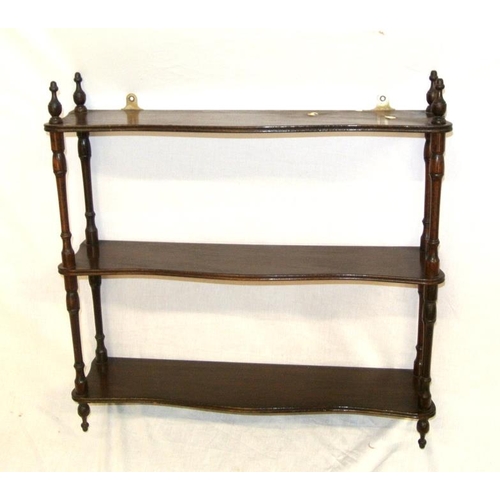 21 - Edwardian mahogany three tier serpentine fronted shelf unit with reeded borders and turned columns