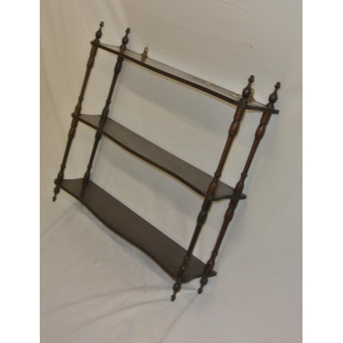 21 - Edwardian mahogany three tier serpentine fronted shelf unit with reeded borders and turned columns
