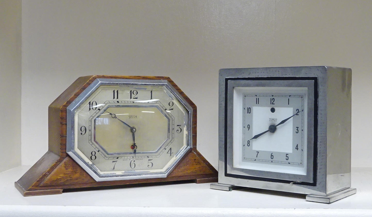 A Temco electric mantel clock in a chromed case; a Smiths electric
