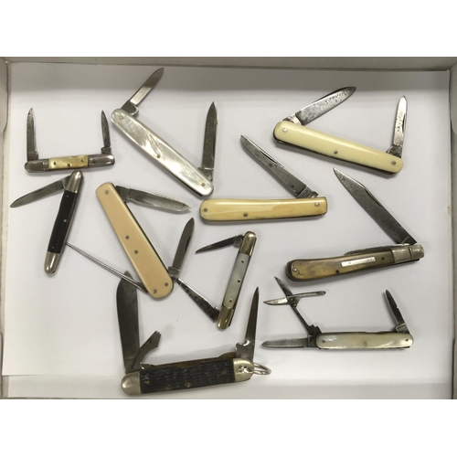 717 - A collection of vintage pocket knives including mother of pearl handled examples.