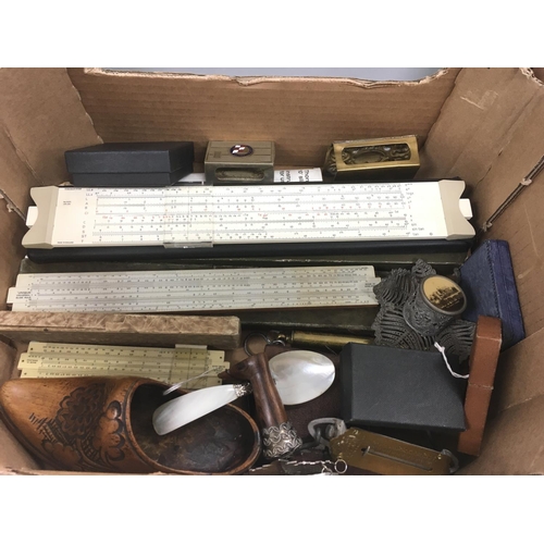 750 - A box of mixed items including treen, matchbox holders, slide rules etc.