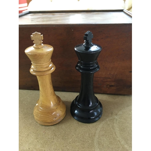 753 - A wooden chess set fitted in mahogany box .