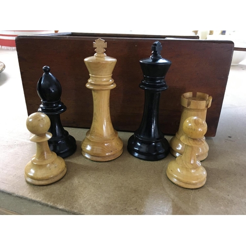 753 - A wooden chess set fitted in mahogany box .