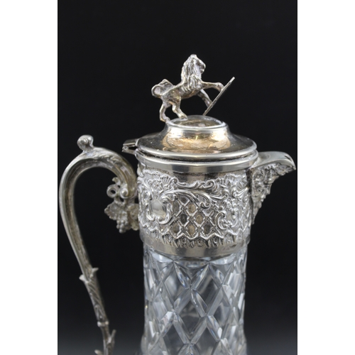 27 - An early 20th century cut glass claret jug, the silver plated collar, with Bacchus spout, decorative... 