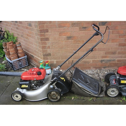 A HONDA GCV 160 PETROL LAWN MOWER and grass bag