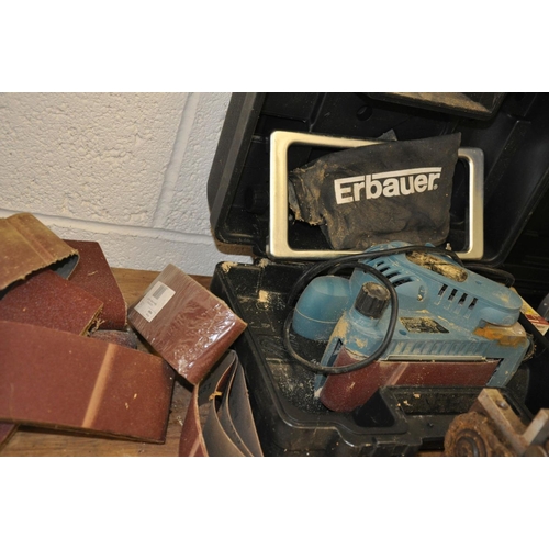 A CASED ERBAUER 3'' ELECTRIC BELT SANDER, with spare belts