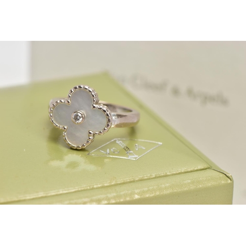 26 - A VAN CLEEF & ARPELS VINTAGE ALHAMBRA RING WITH BOX, with mother of pearl motif and central collet s... 