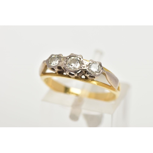 4 - AN 18CT GOLD THREE STONE DIAMOND RING, designed as three graduated brilliant cut diamonds in illusio... 