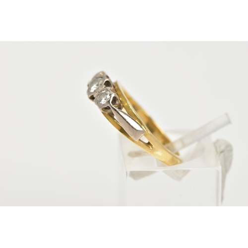 4 - AN 18CT GOLD THREE STONE DIAMOND RING, designed as three graduated brilliant cut diamonds in illusio... 