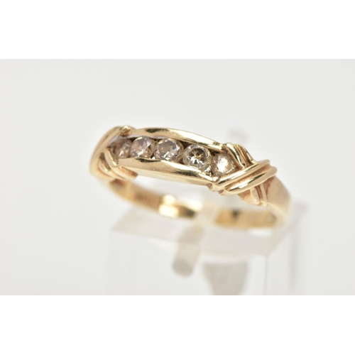 5 - A 9CT GOLD FIVE STONE DIAMOND RING, designed as five brilliant cut diamonds, in a channel setting wi... 