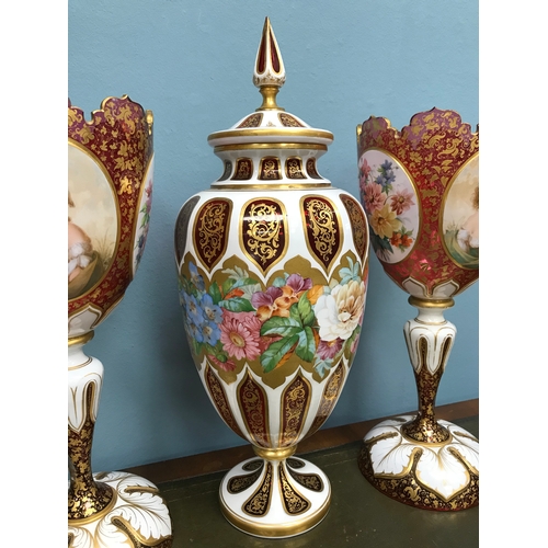 93 - A Pair of Cranberry glass Bohemian Moser White enamel overlay vases and matching urn with lid. Both ... 